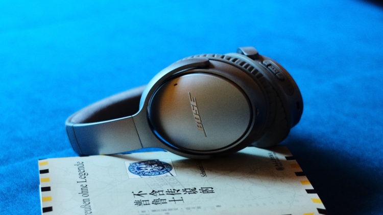 Bose QC35 Noise cancelling headphones over book -