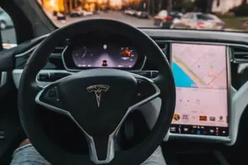Man sitting inside a tesla with no cabin noise