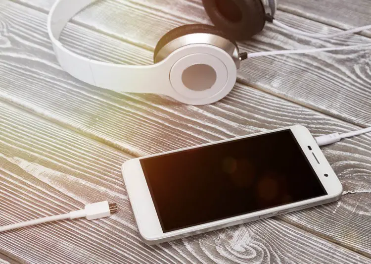 Using headphones while charging your phone can shock or even electrocute you