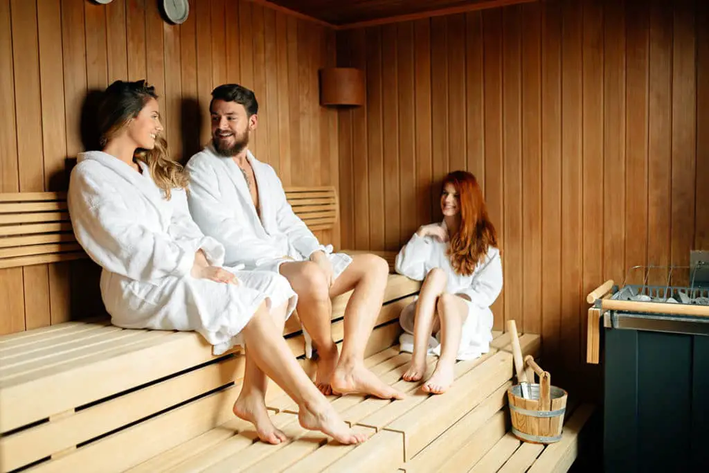 Friends chose to relax instead of using their headphones in the sauna